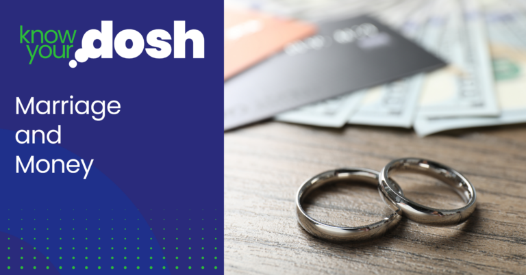 wedding rings on a table alongside bank cards and bank notes to symbolise marriage and money
