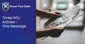 hands holding out a newspaper front page