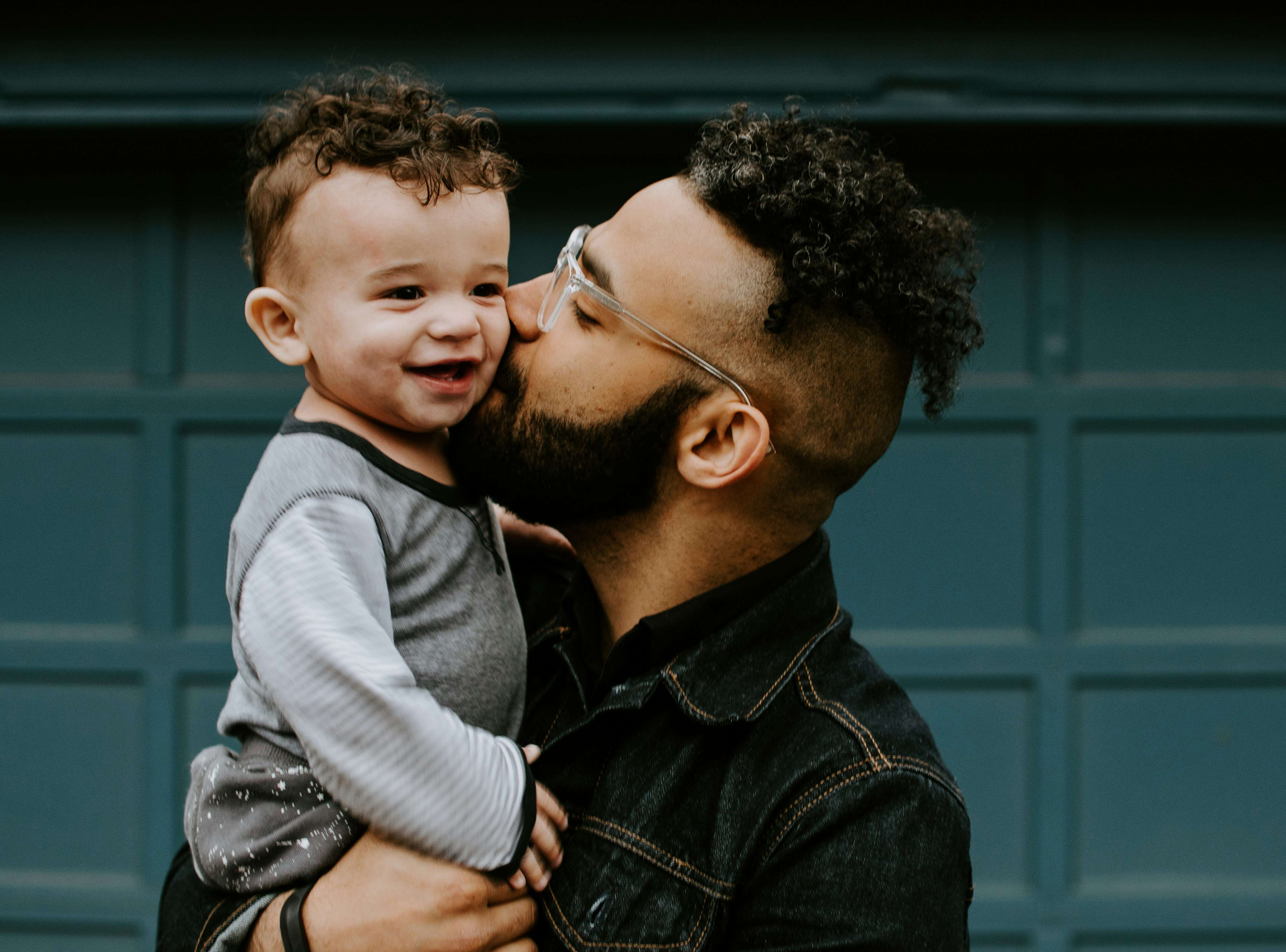 father holding son